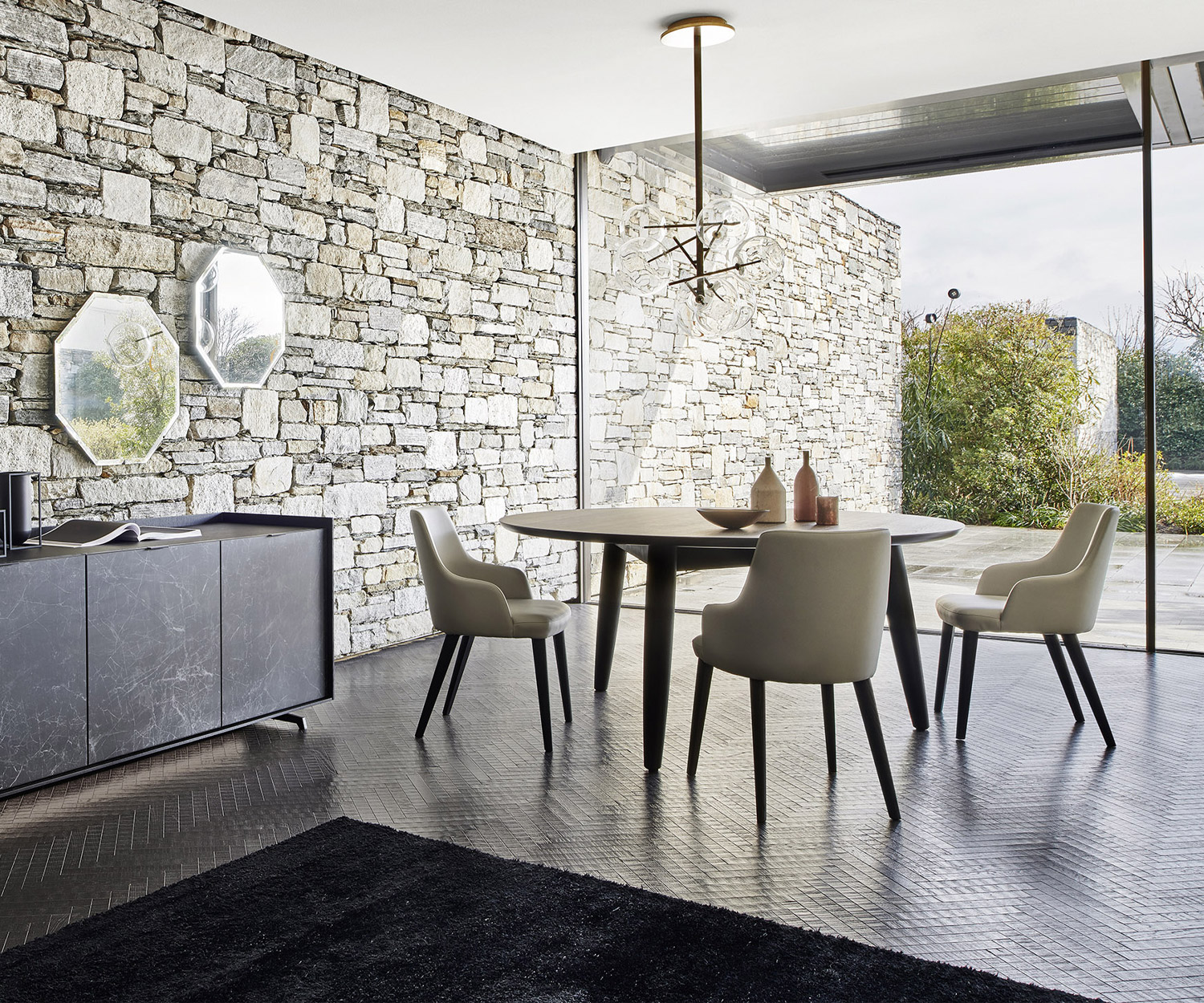 Convivio round dining room table from Livitalia with table top in white ceramic