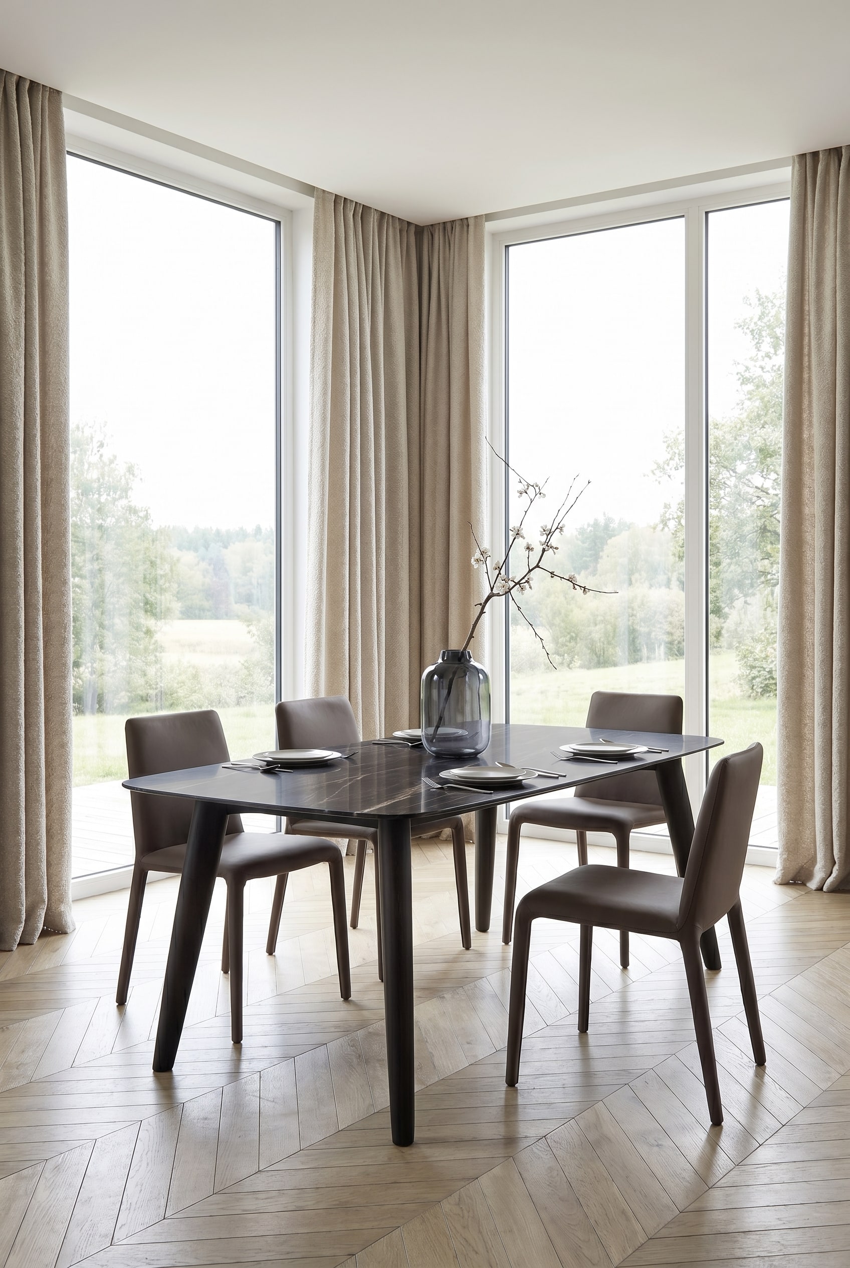 Modern dining room with a dark ceramic dining table, surrounded by light boucl&eacute; chairs with delicate legs