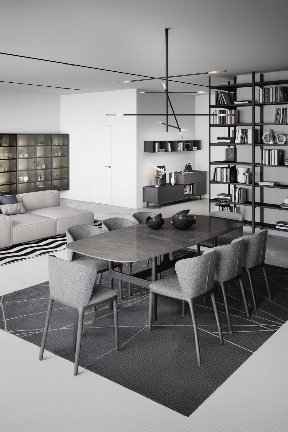 modern-gestaltetes-wohnzimmer-in-grau-schwarz-und-weiss-mit-organisch-geformtem-esstisch