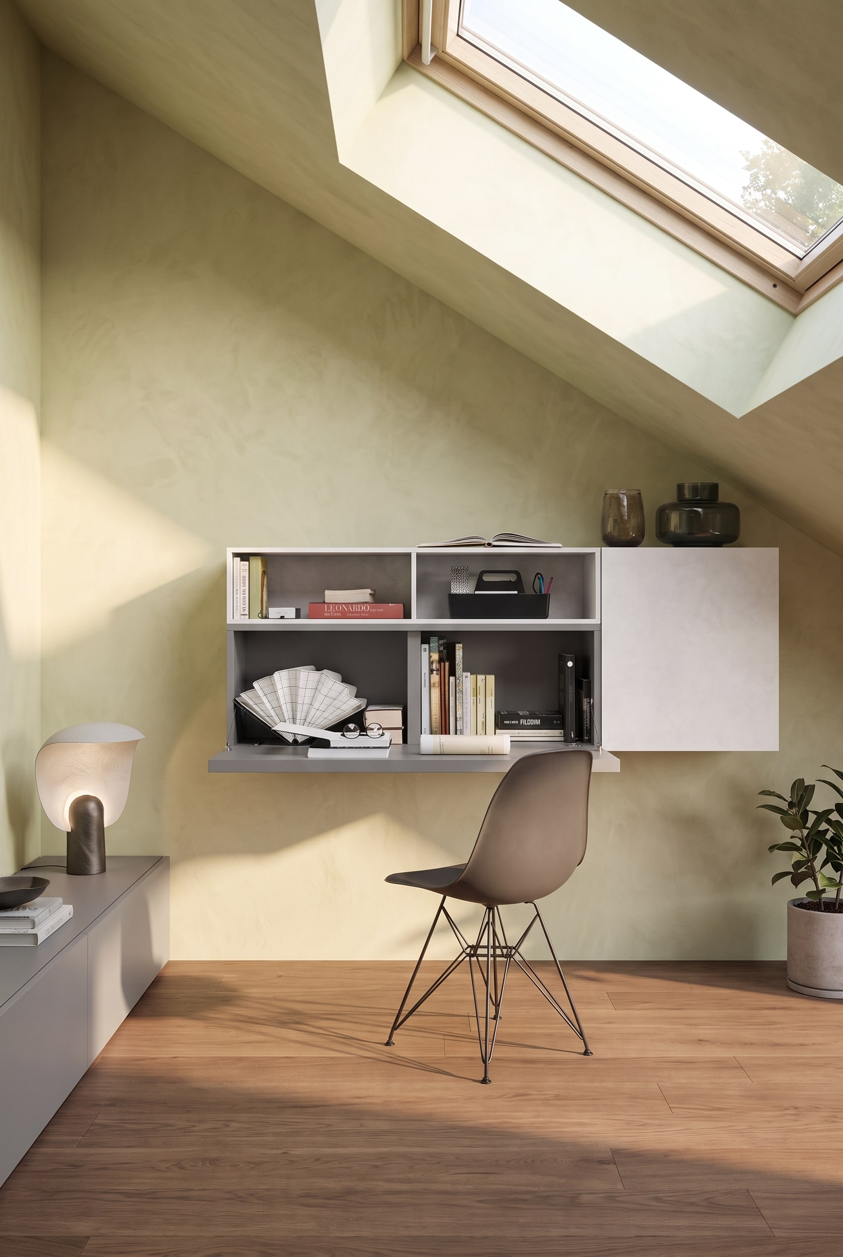 An elegant home office in the attic with a minimalist, wall-mounted desk cabinet under the sloped ceiling.
