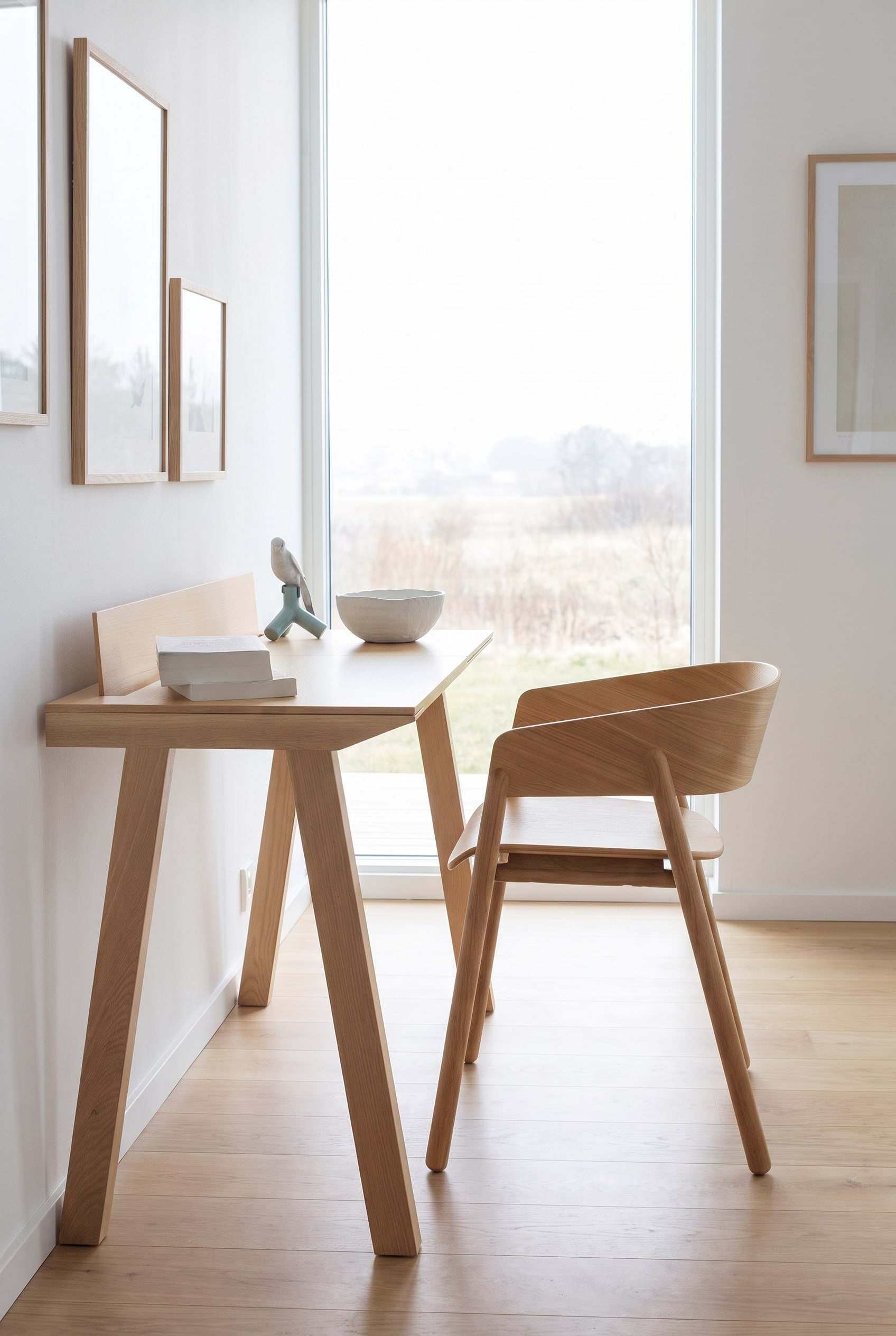 Minimalist dining area with a dining table and a solid wood chair made of light oak