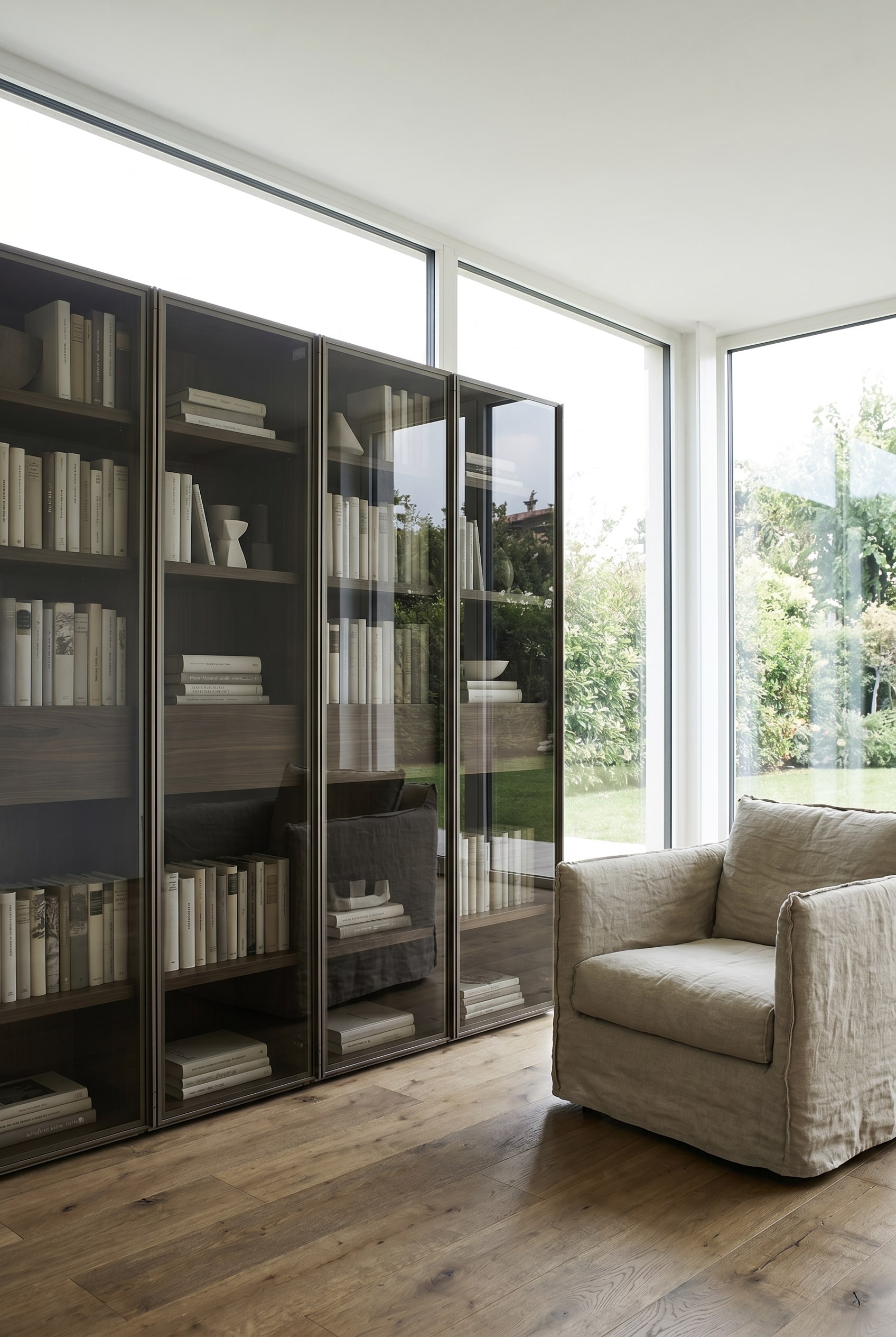 Dark brown real wood shelf with tinted glass doors and integrated LED lighting in a minimalist living room