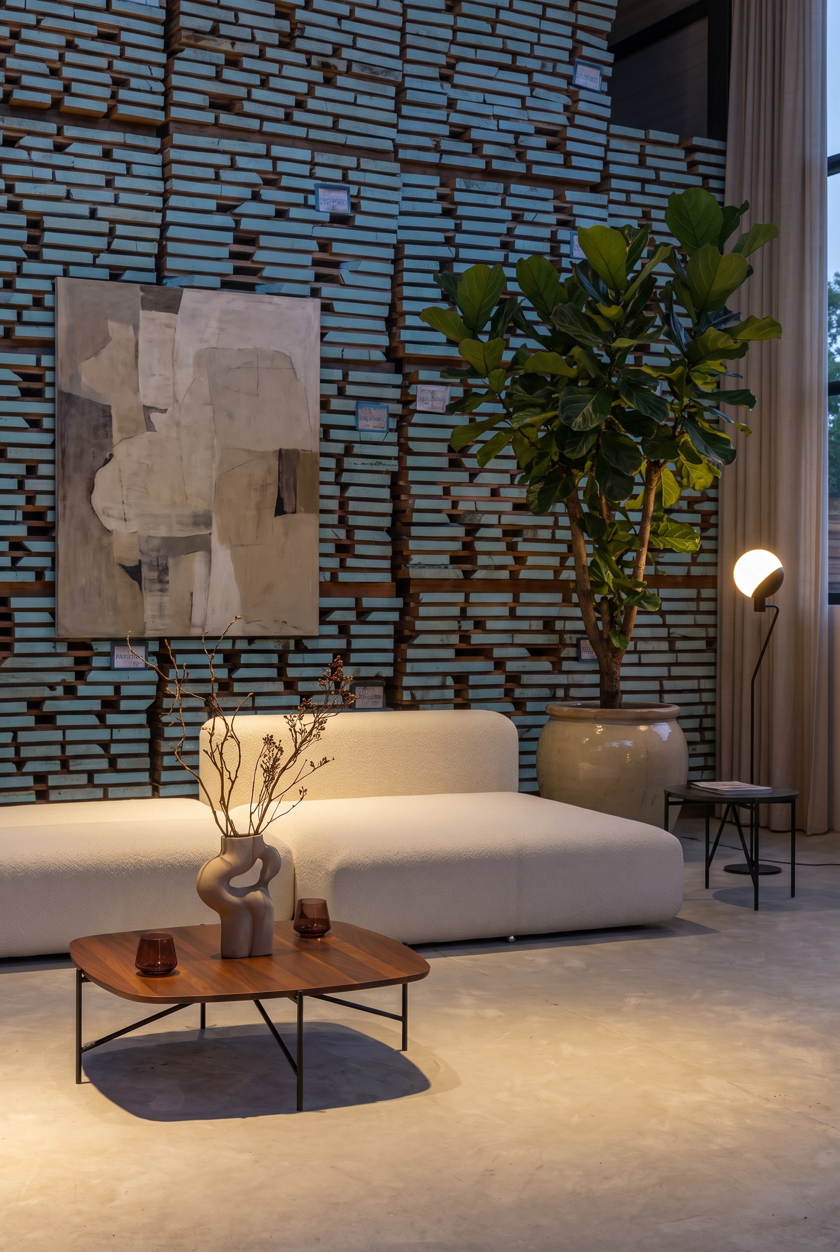 Modular white sofa bed in modern loft design in front of a structured wooden wall