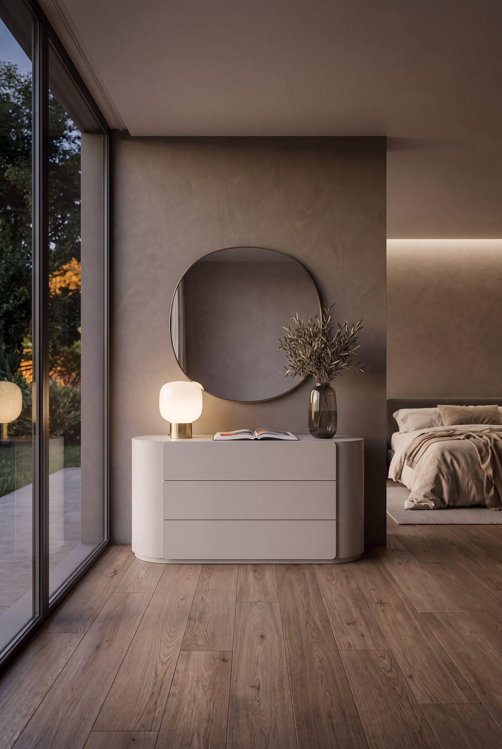 Matte, light grey chest of drawers with rounded corners in a modern bedroom with a large mirror.