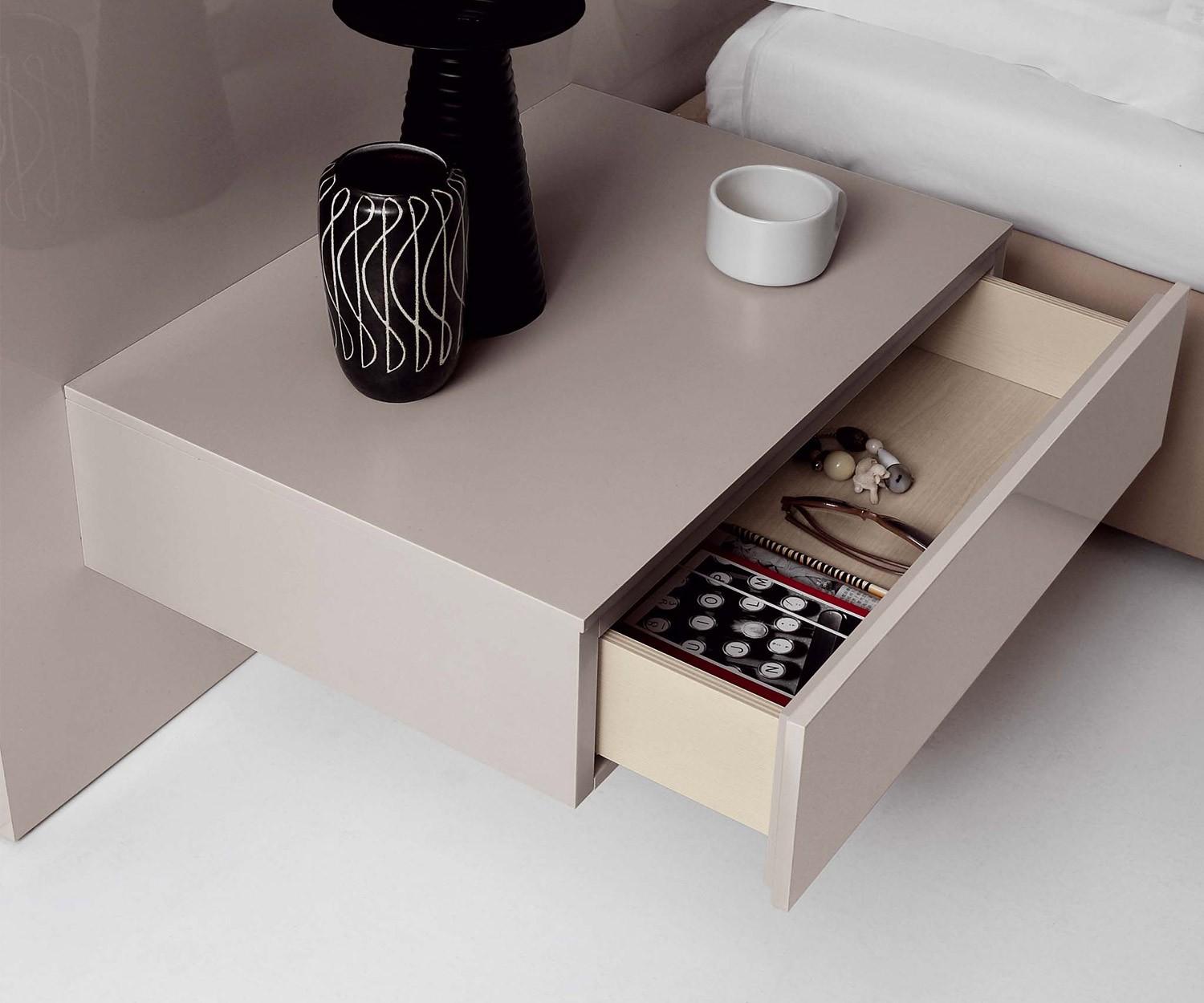 Floating bedside table drawer next to the bed