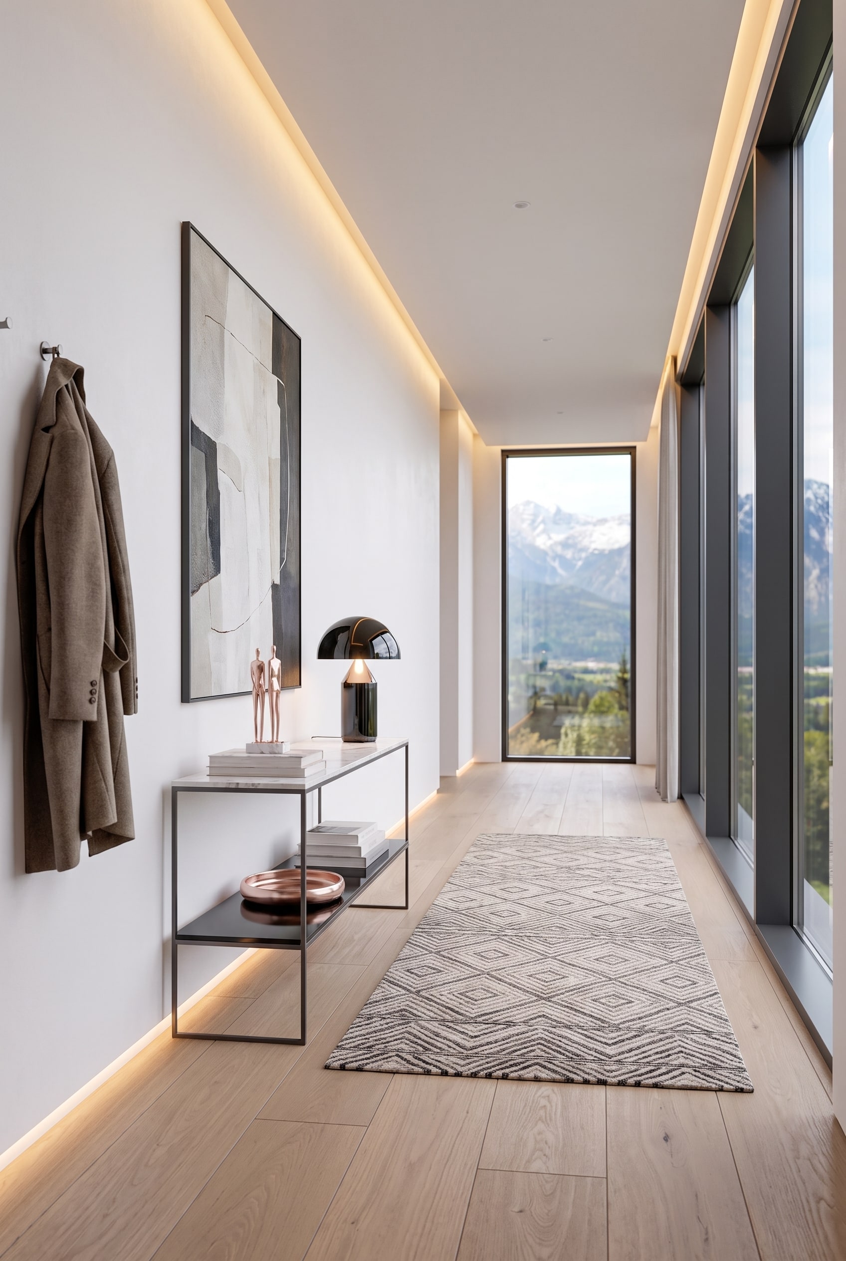 Modern entryway with a console made of dark metal and a marble top, with a sculptural lamp on it, and large windows in the background