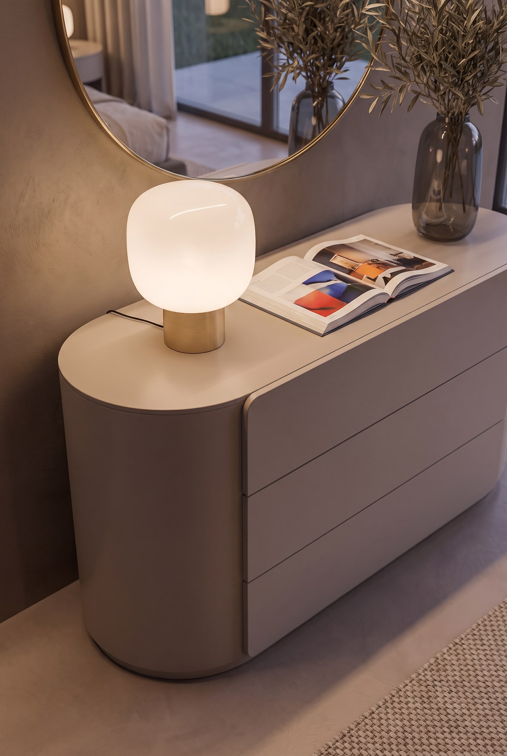Close-up of the rounded corner of a matte chest of drawers, showing the handleless design and precise gap dimensions.