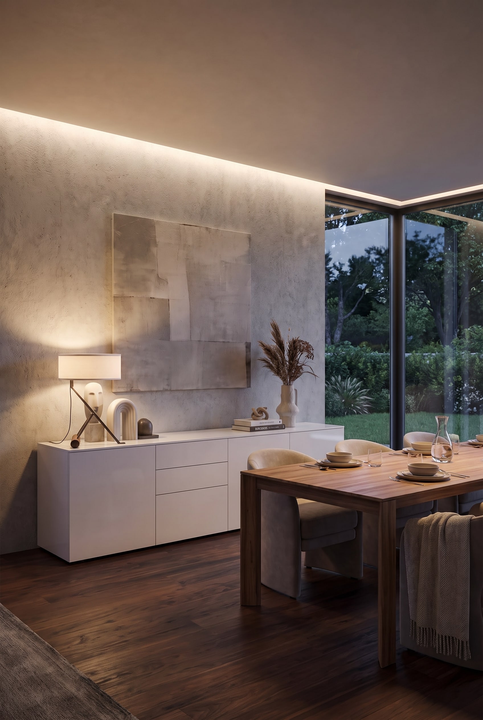 An elegant sideboard in a modern dining room, decorated with a table lamp and framed by ample free wall space.