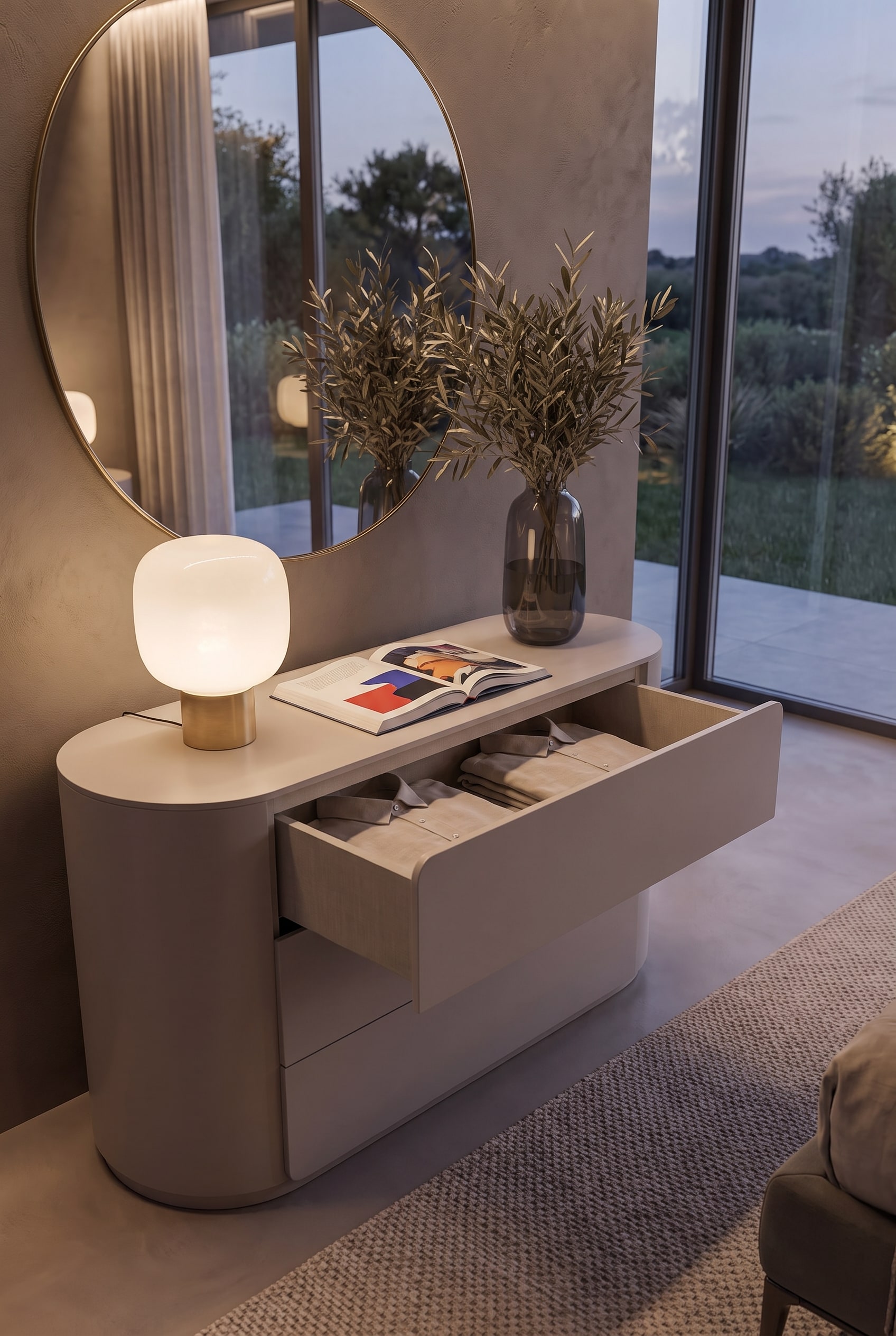 Open drawer of the Livitalia chest of drawers, showing folded shirts and the cleanly finished interior.
