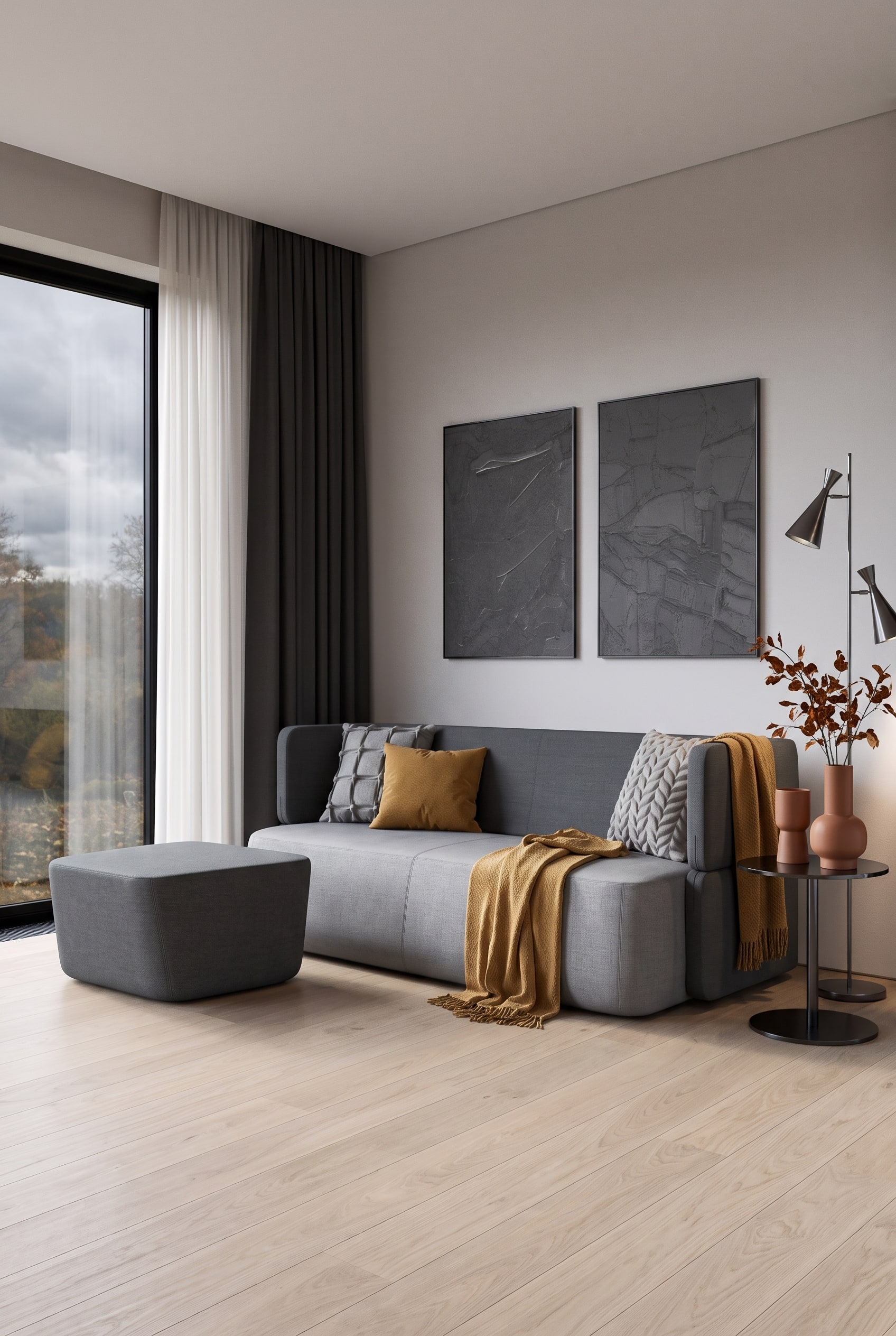Mustard yellow sofa bed in front of a grey wall in an autumnally decorated living room with terracotta accents