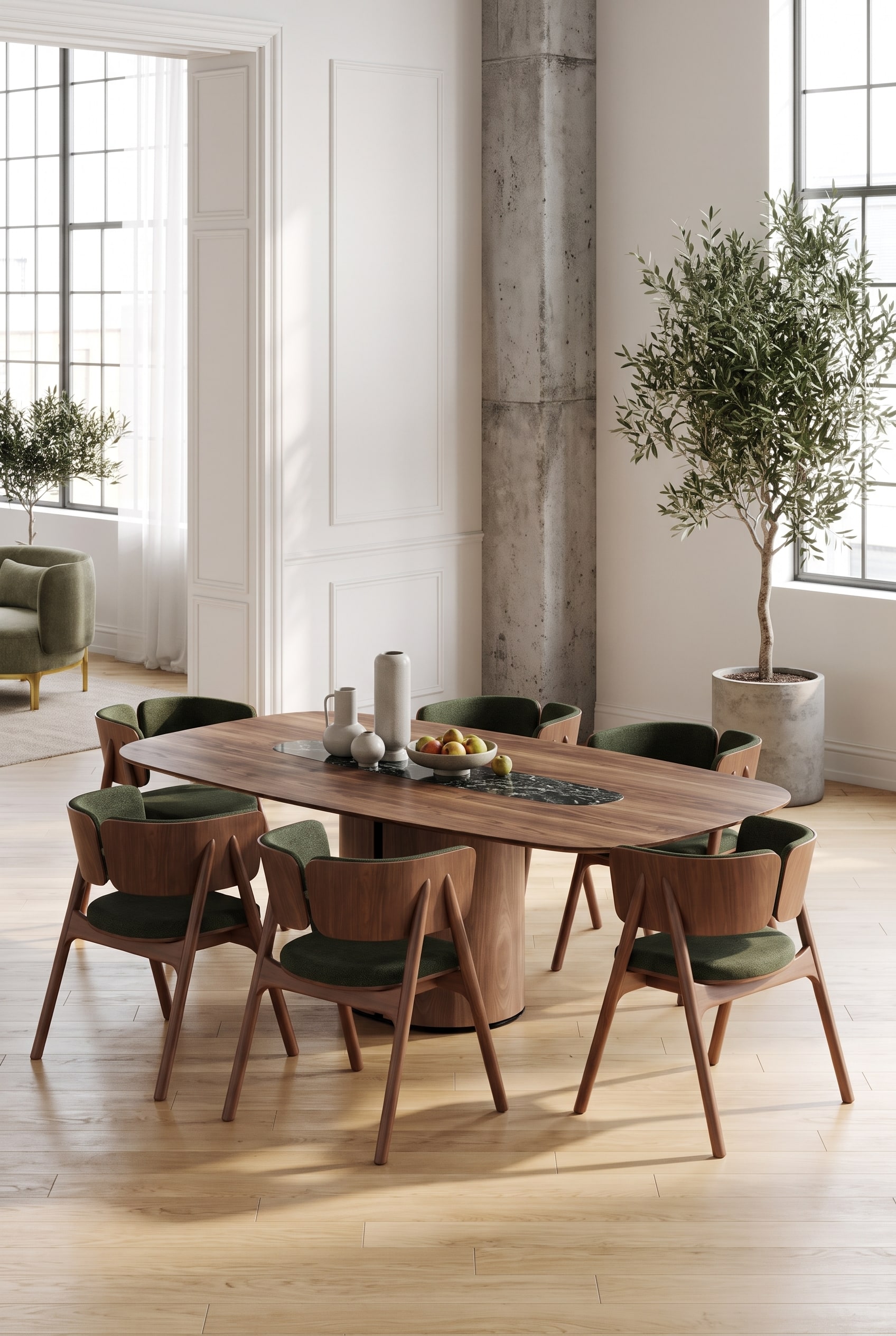 Dining area in a loft with a walnut dining table and green upholstered chairs in front of tall windows